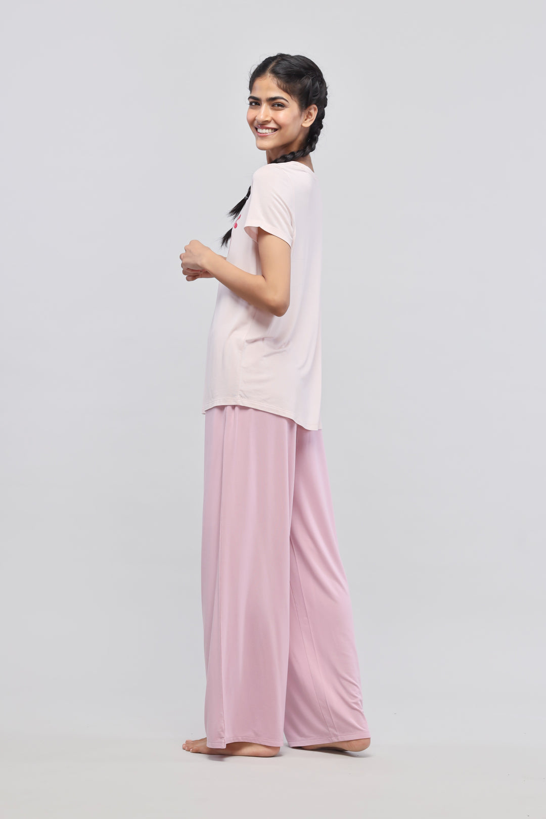 Deep pink flared pajama set with side slits for comfortable lounging.
