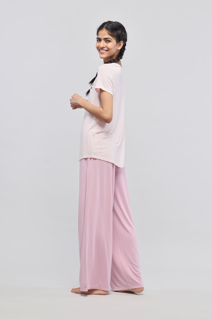 Deep pink flared pajama set with side slits for comfortable lounging.