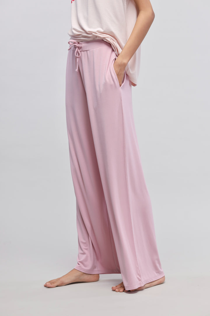 Deep pink flared pajama with side slits and pockets.