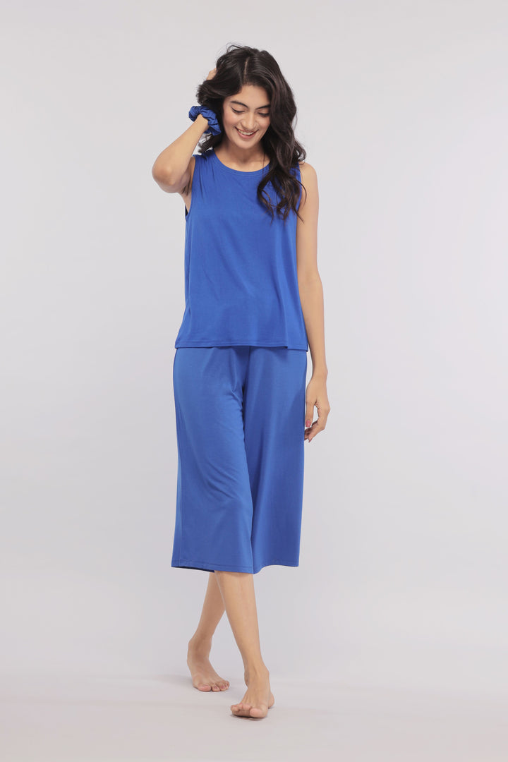 True Blue Culottes worn by a smiling woman in blue outfit.