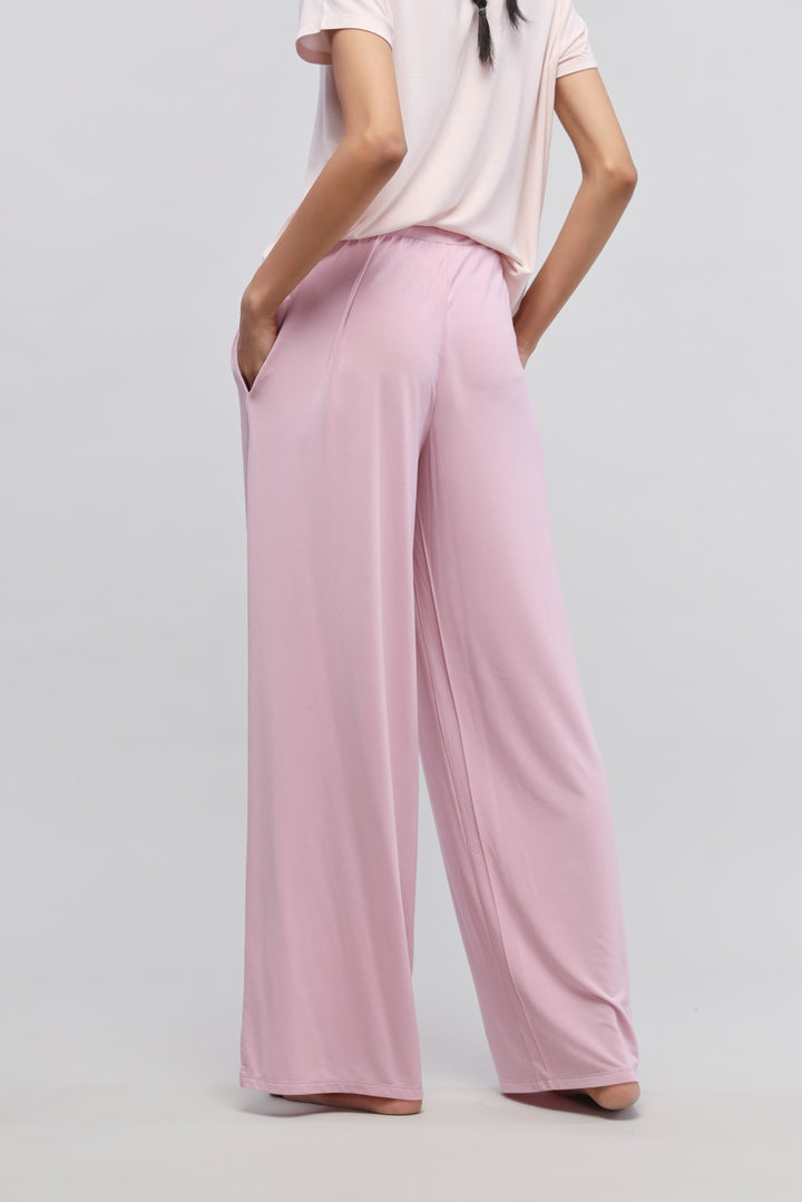 Deep pink flared pajama pants with side slits and pockets.