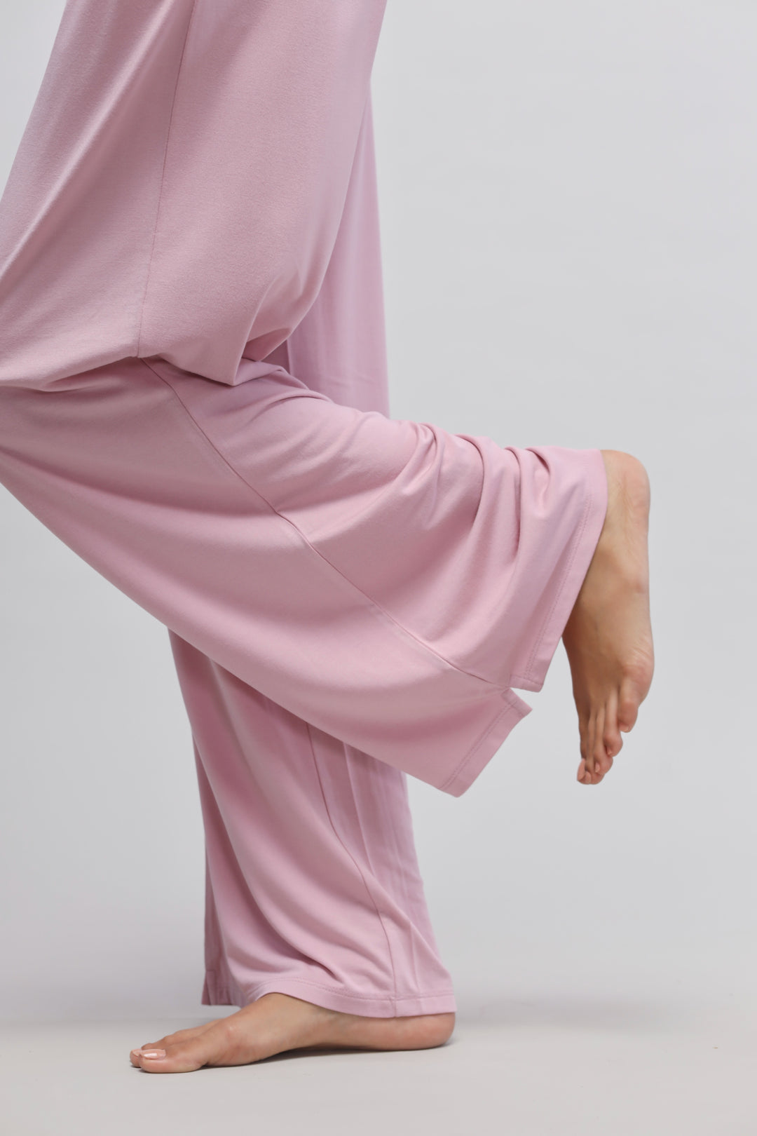 Deep pink flared pajama showcasing side slits and relaxed fit.