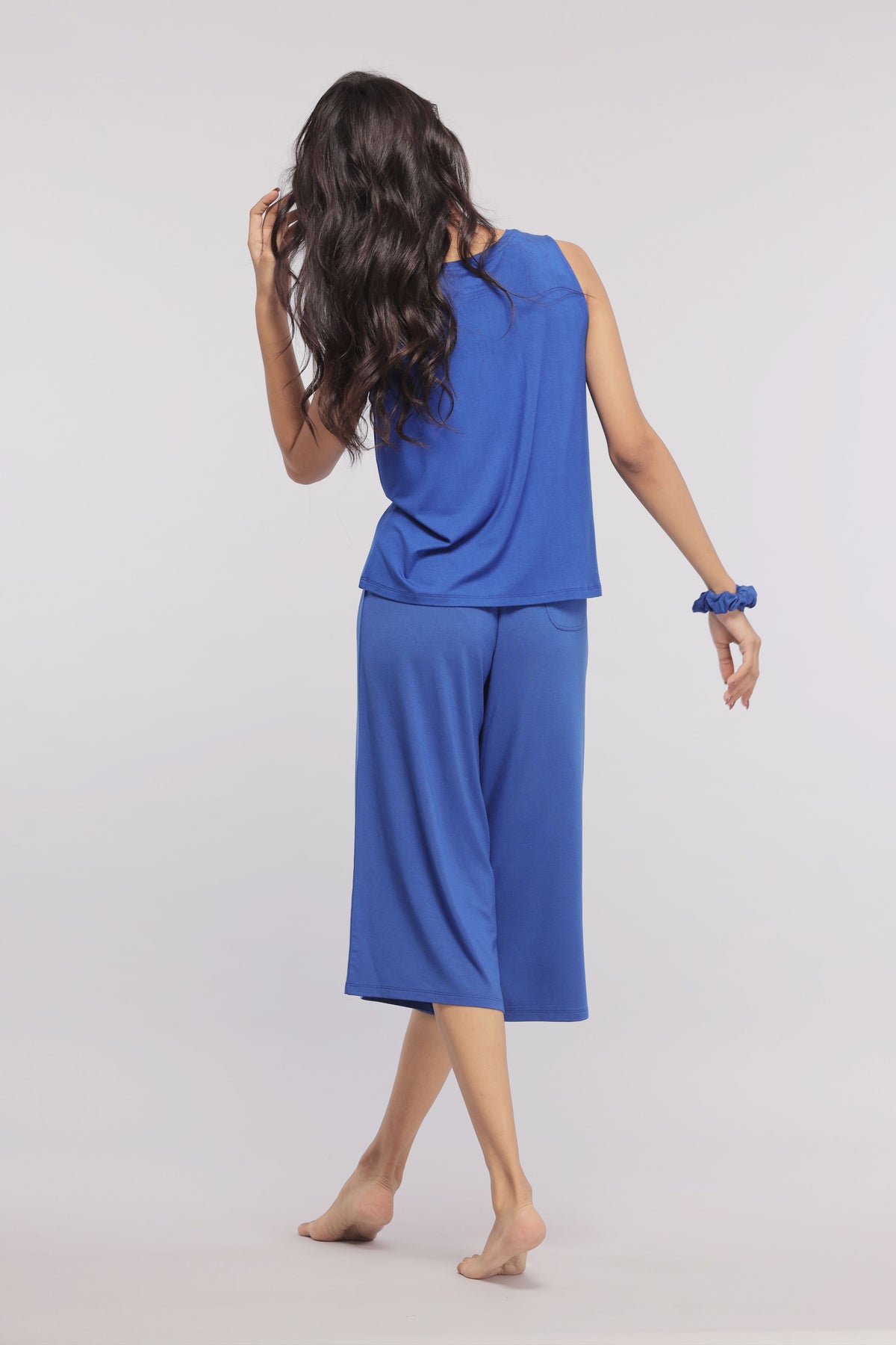 Model showcasing True Blue Culottes in vibrant blue.