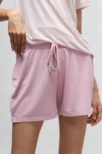 Deep pink shorts with side slits for comfortable summer wear.