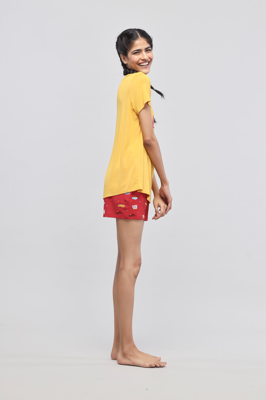 Self Love Shorts Set worn by model, bright yellow top and red shorts.