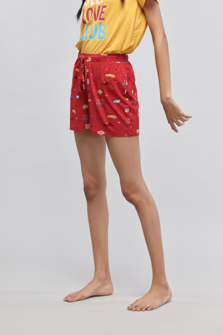 Red self-love shorts with playful patterns and drawstring waistband.