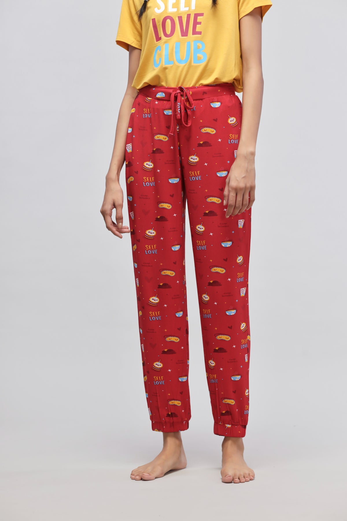 Self Love Cuffed Pajamas in red with playful patterns and a cozy fit.