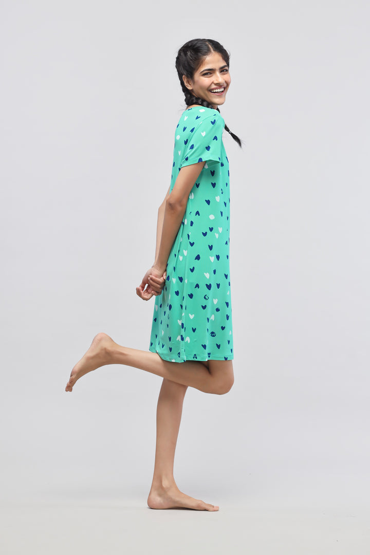 Cheerful model wearing Heartsy Short Dress with heart pattern.