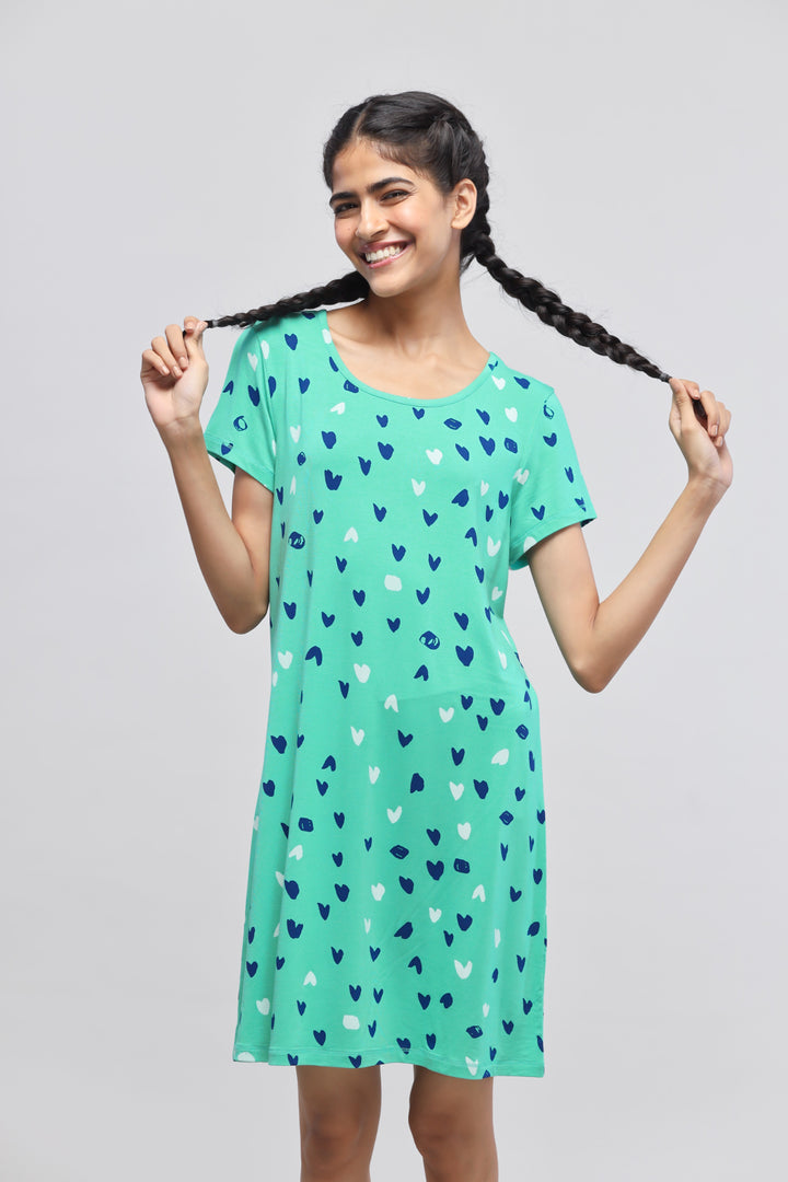 Heartsy short dress featuring heart patterns in vibrant teal color.