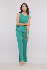 Green flared lounge pants with side slits for comfort and style.