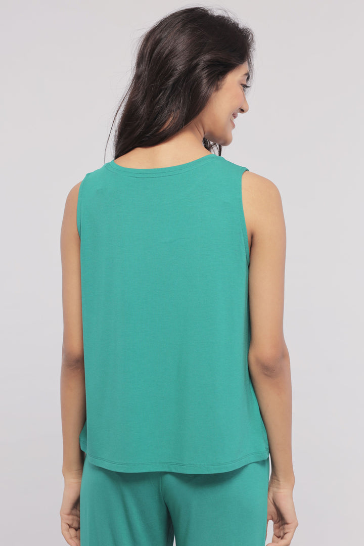 Green sleeveless cropped top on a model showcasing the back view.