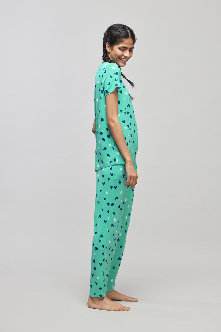 Heartsy Pajama Set in vibrant teal with playful heart patterns.