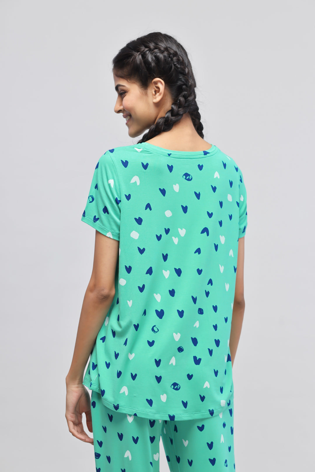 Heartsy Pajama Set in fun heart pattern with mint green background.