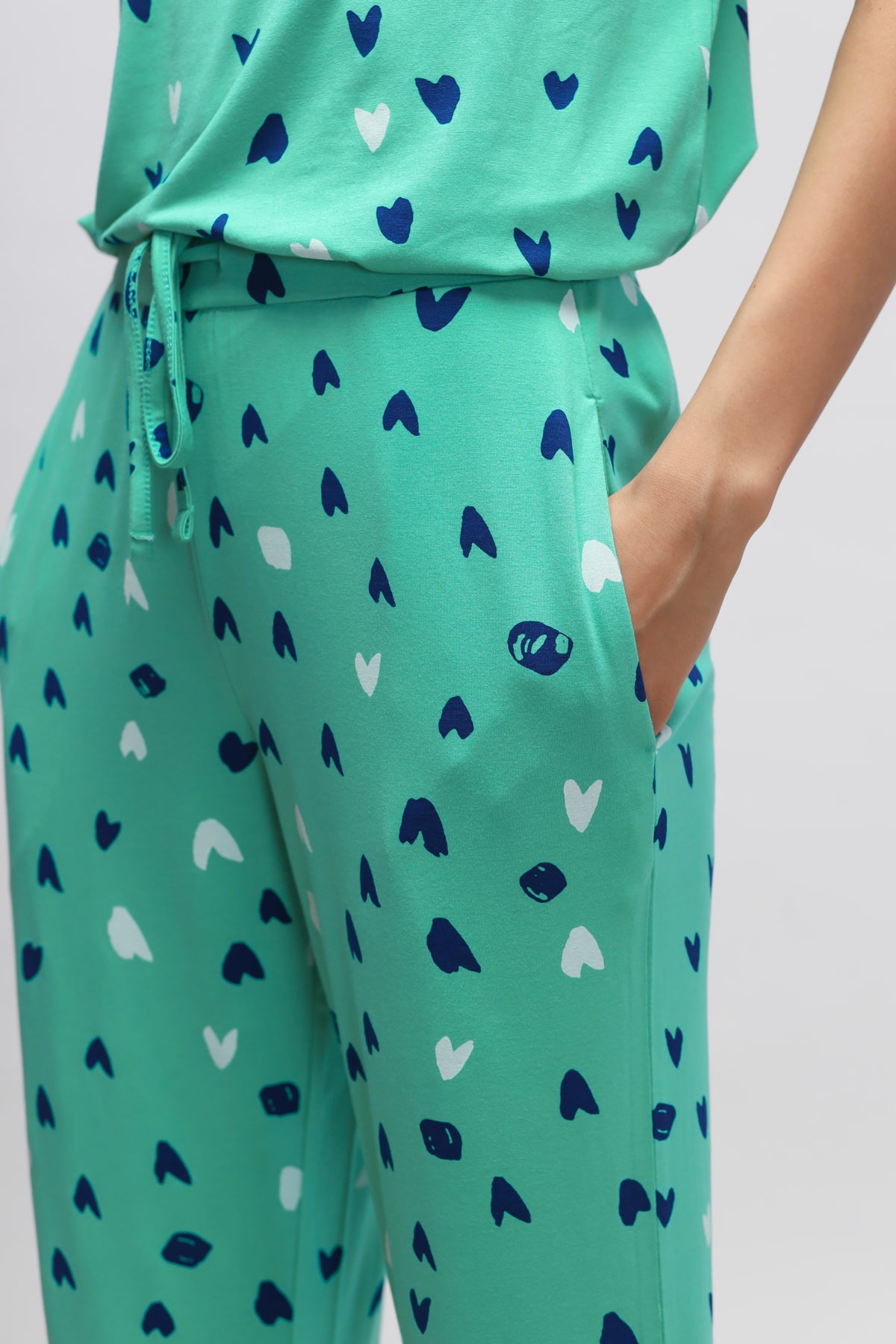 Heartsy Pajamas in teal with colorful heart patterns for comfort and style.