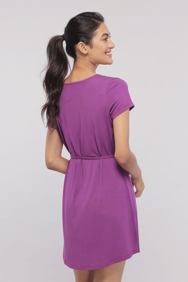 Breezy purple sleep dress on a smiling model from the back.