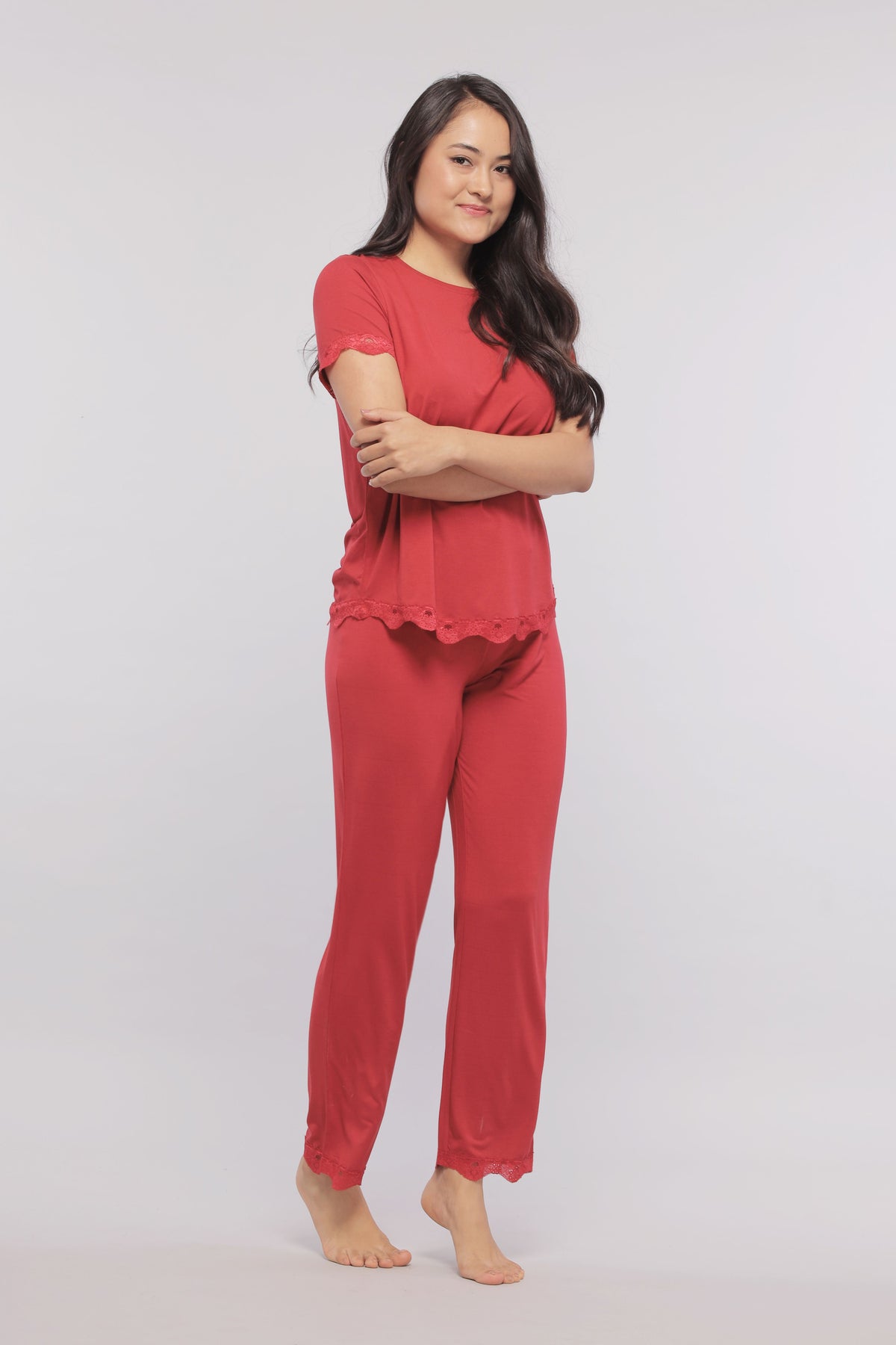 Romantic red lace top and matching pants for stylish comfort.