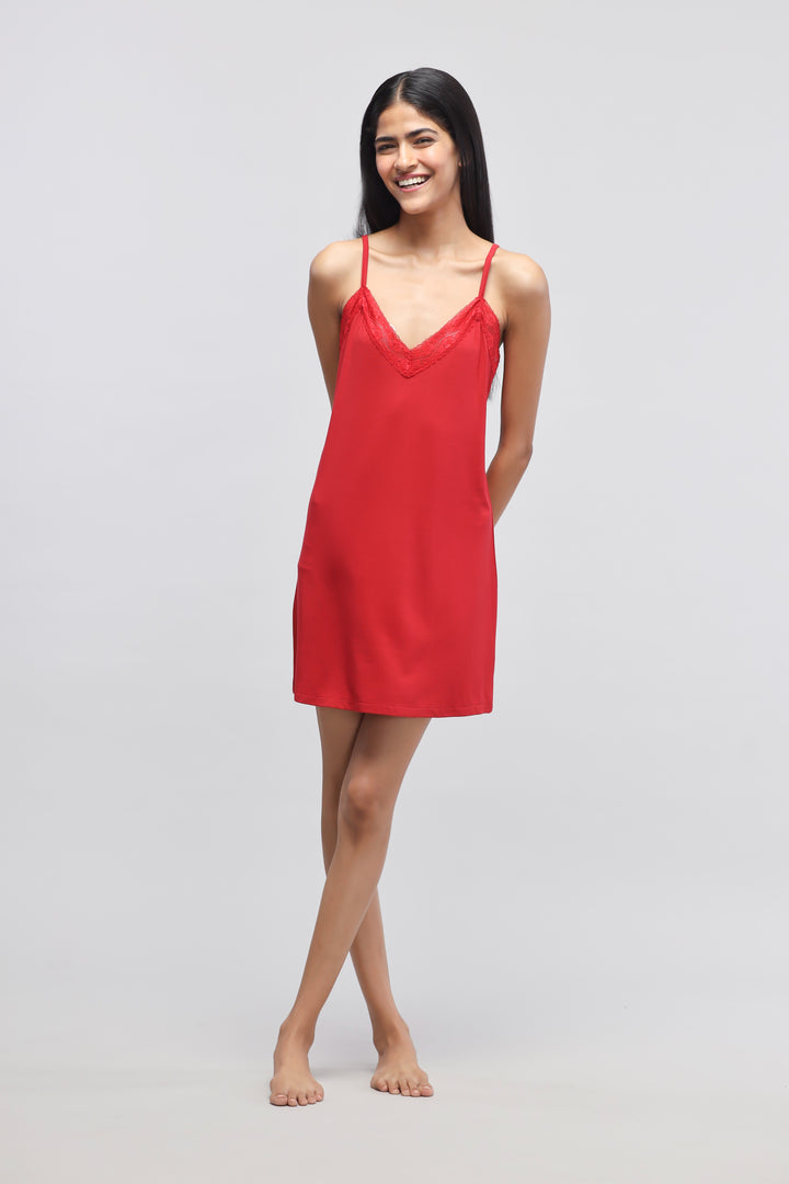 Cherry red lace short dress on a smiling model.