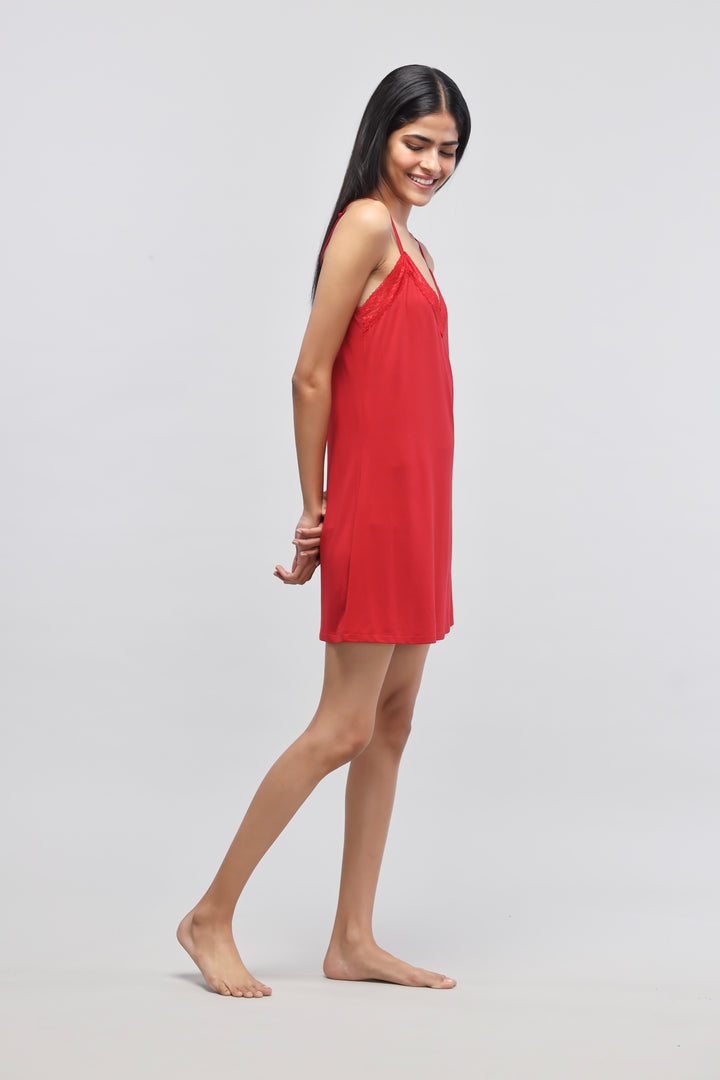 Cherry red lace short dress on a model, showcasing stylish design.