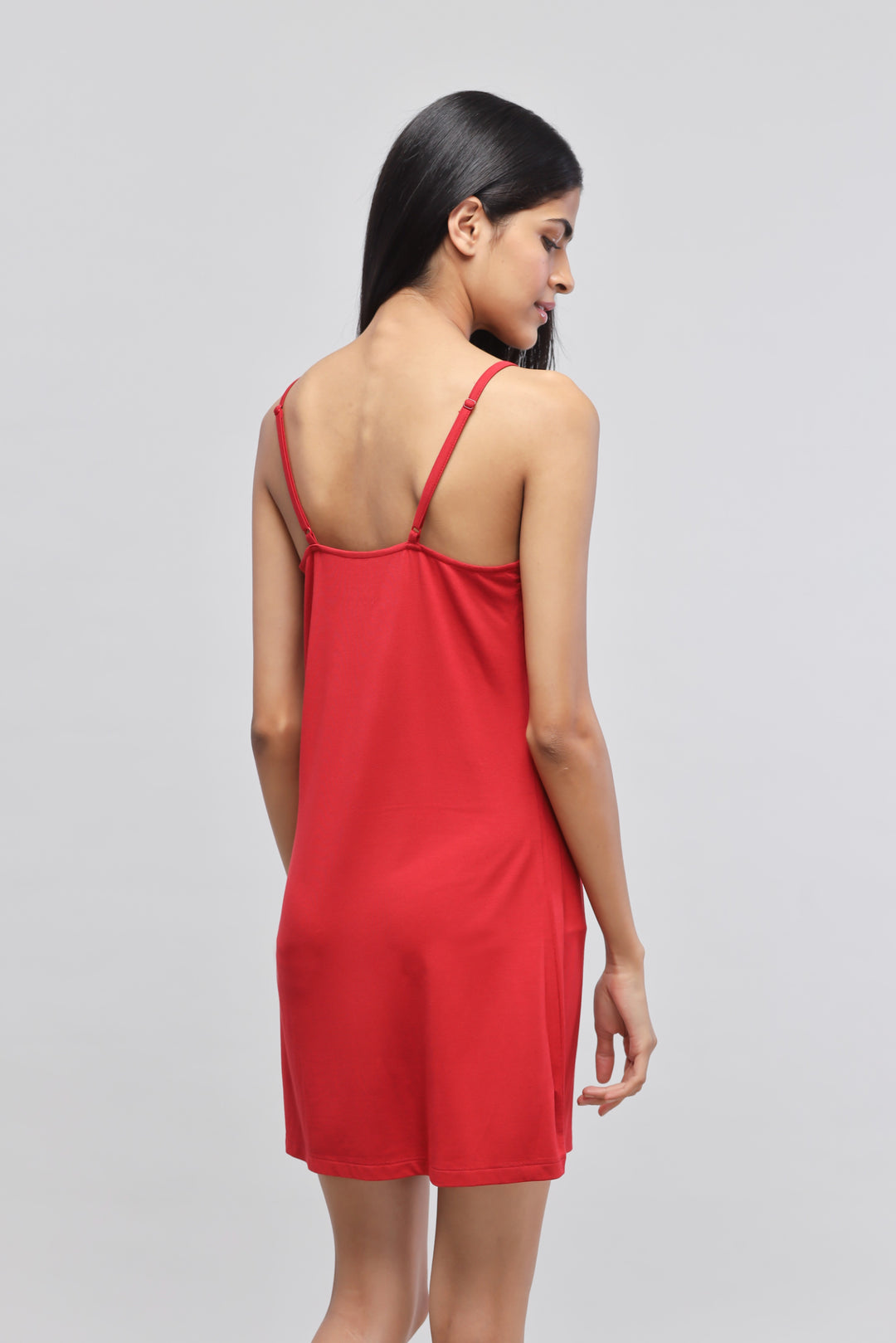 Cherry red lace short dress showcased from the back.