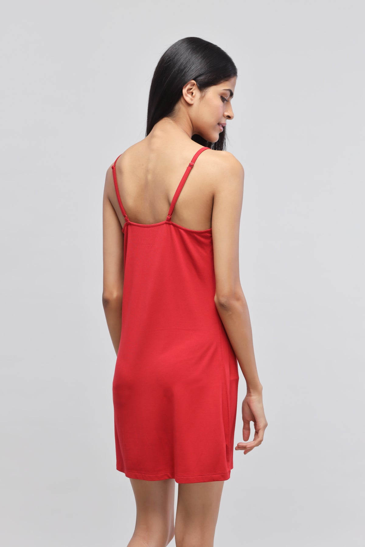Cherry red lace short dress showcased from the back.
