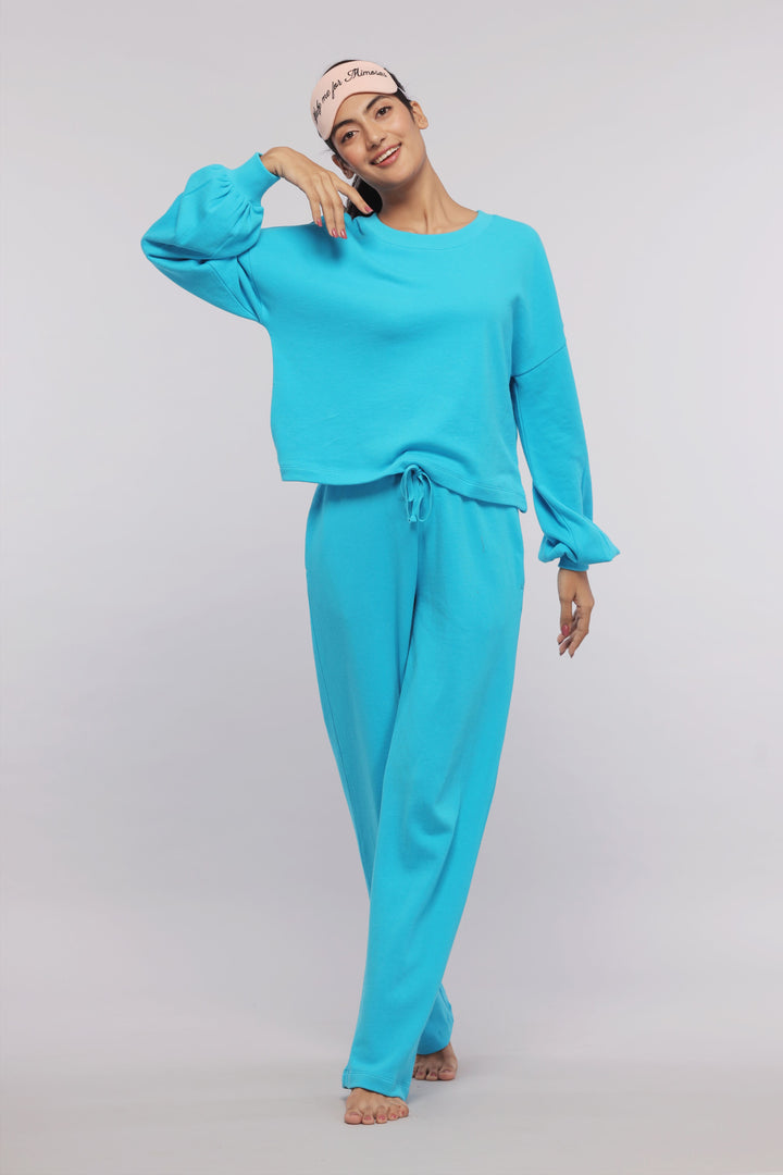 Model in Aqua Terry Travel Loungers showcasing comfy loungewear.