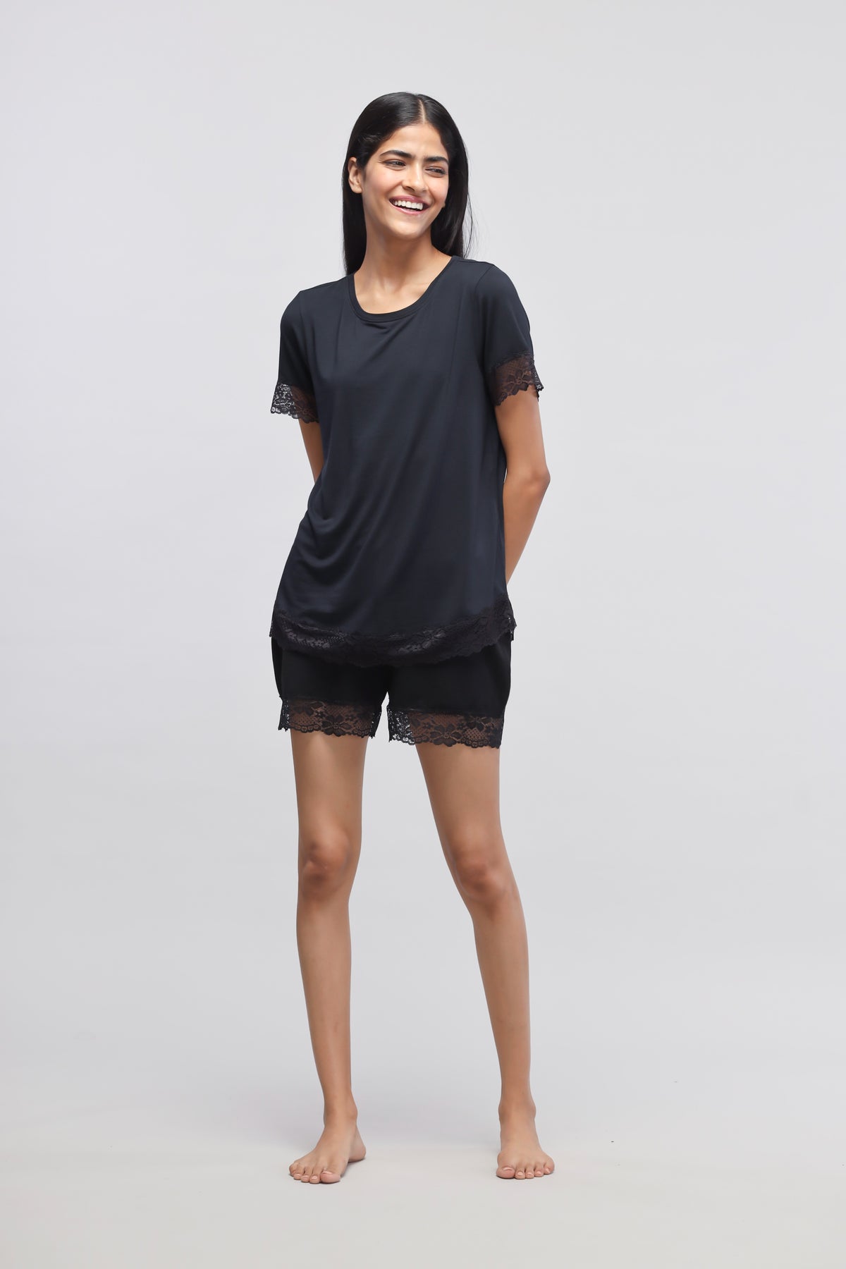 Delicate black lace top and shorts, stylish and comfortable loungewear.