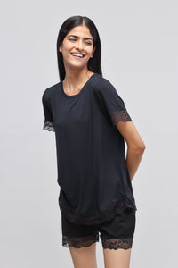 Delicate black lace top with short sleeves and stylish design.