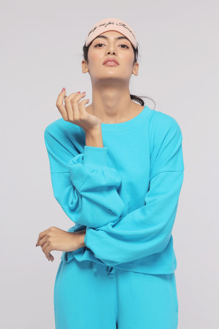 Aqua Terry Travel Loungers featuring a stylish model in blue outfit.