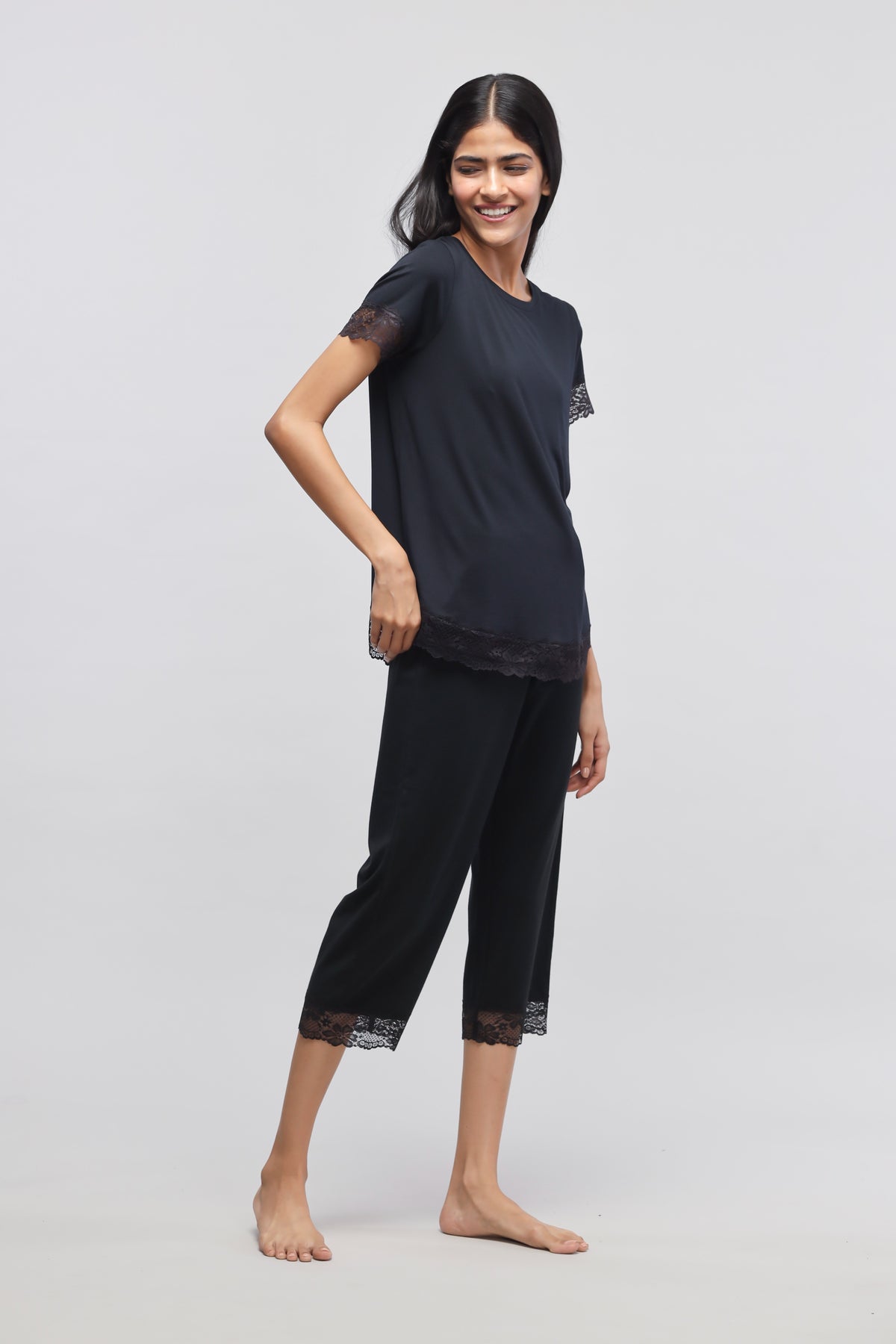 Delicate black lace capri set for stylish loungewear.