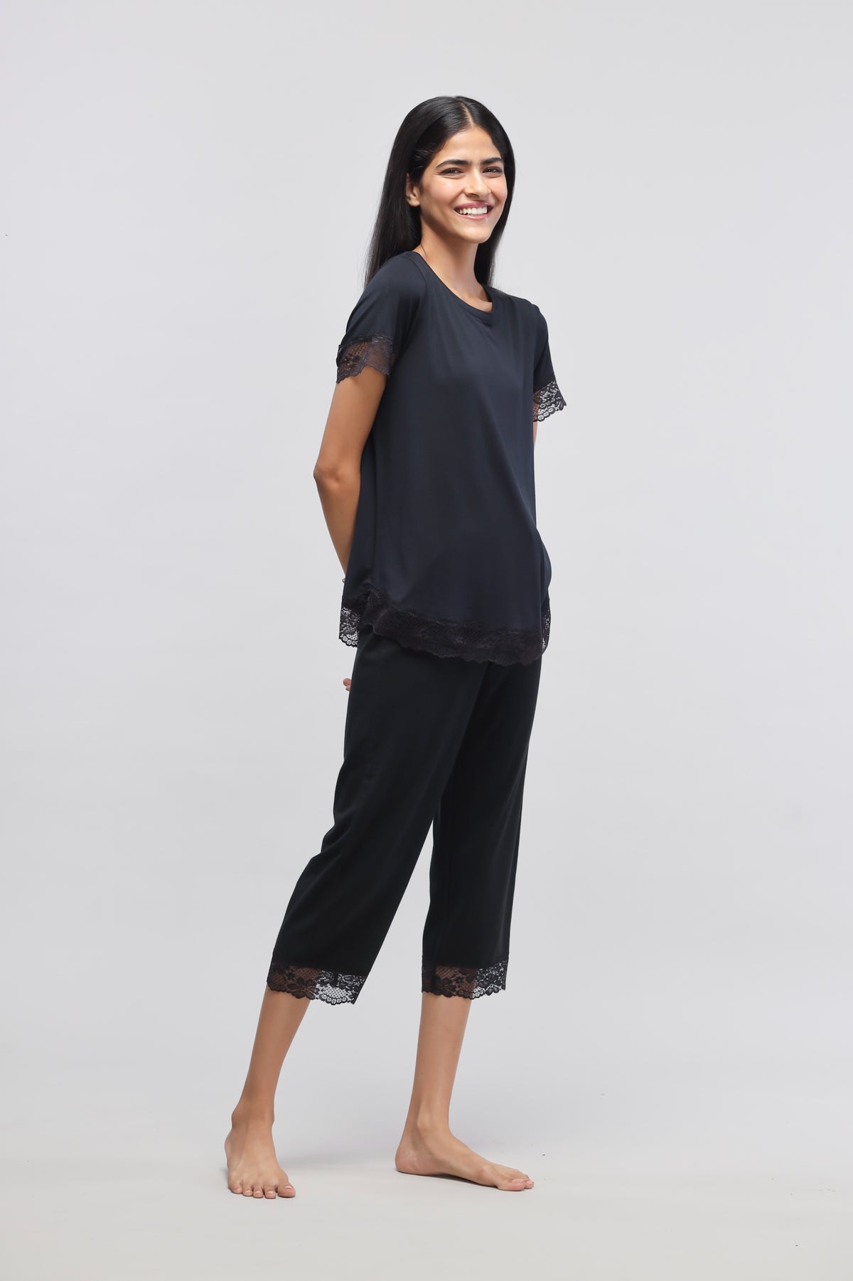 Delicate black lace capri set, stylish and comfortable loungewear.