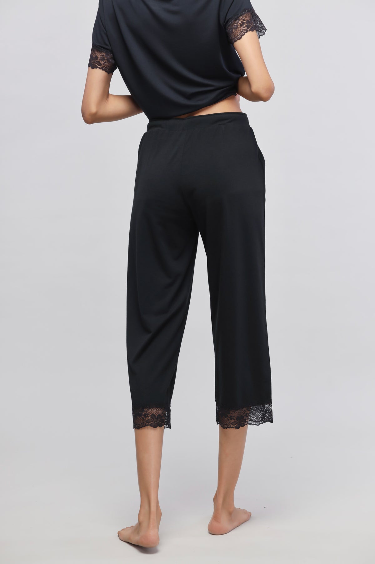 Delicate black lace capri stylish women's loungewear with elegant detailing.