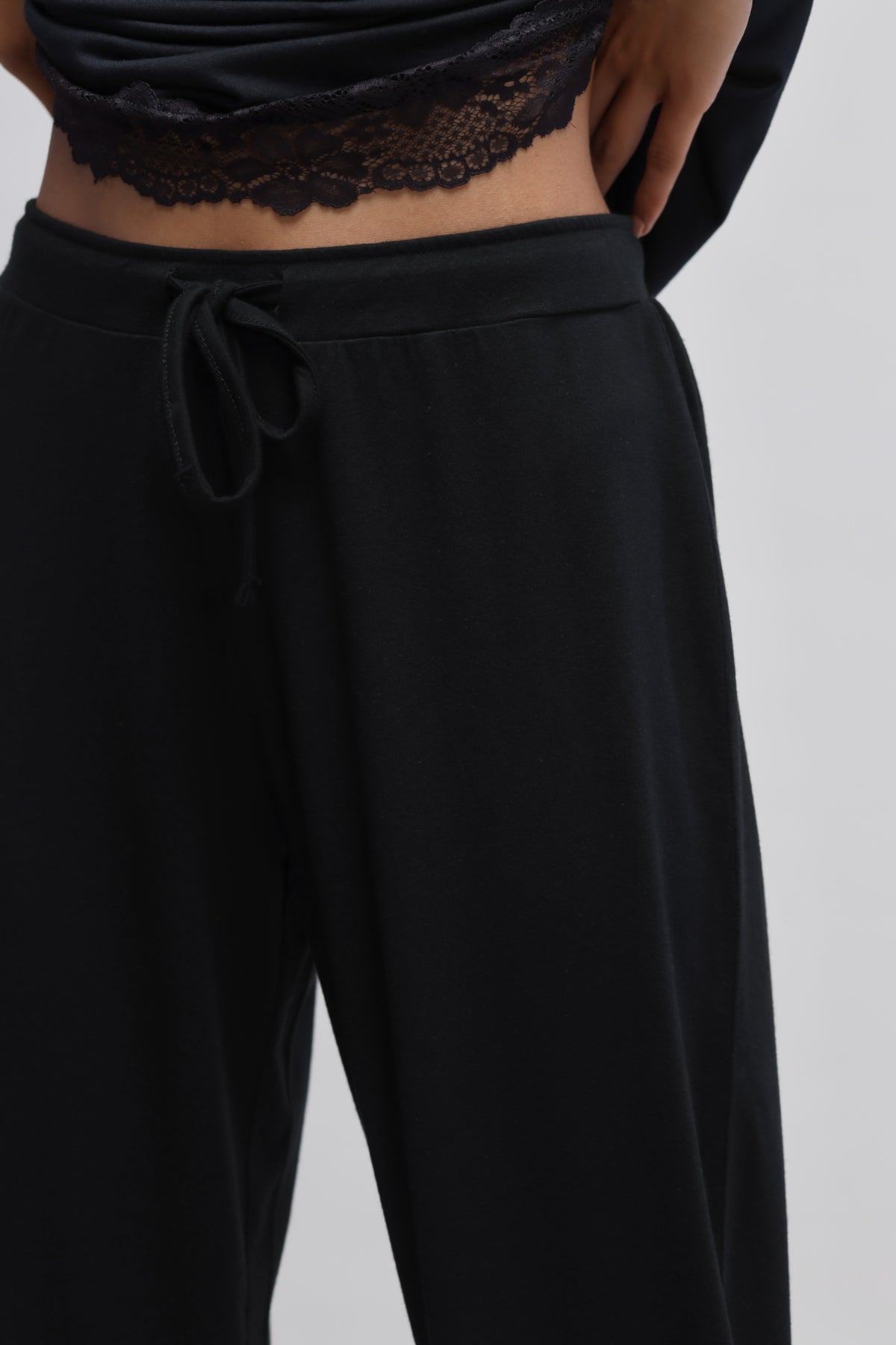 Delicate Black Lace Capri with stylish drawstring waist detail.
