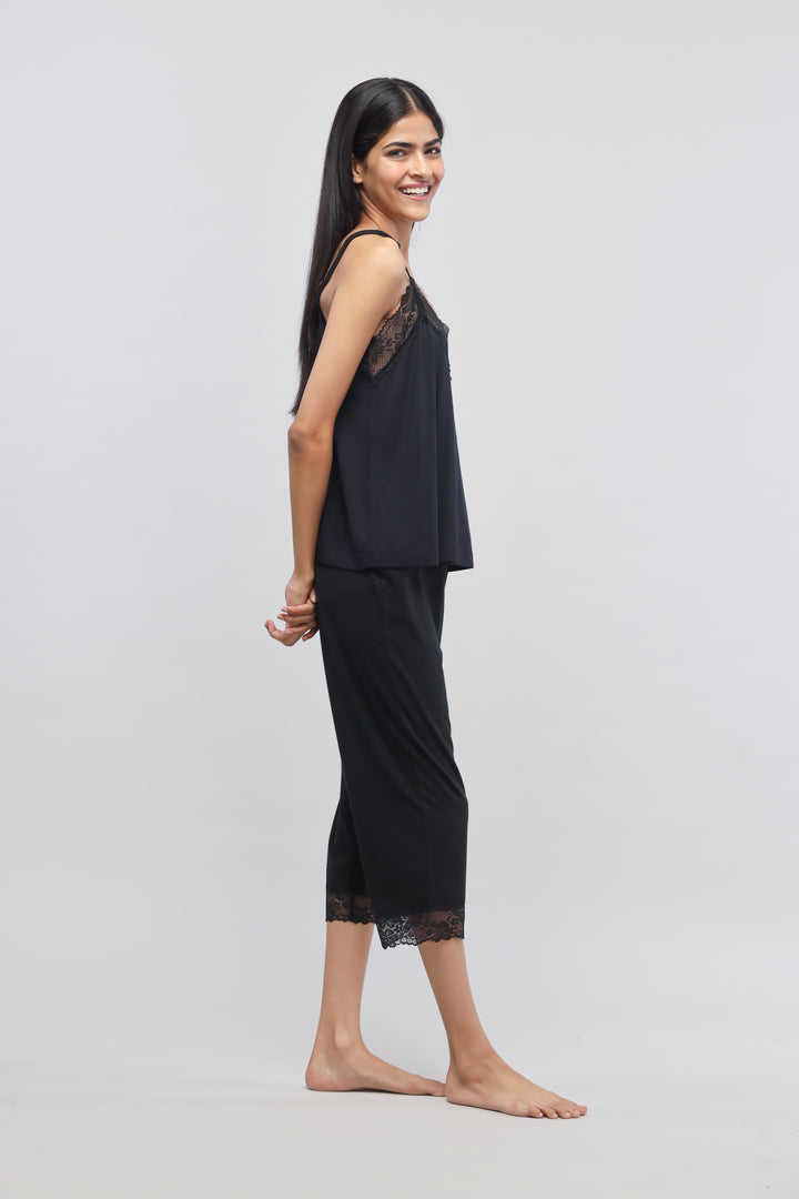 Delicate black lace tank top with stylish, relaxed fit.