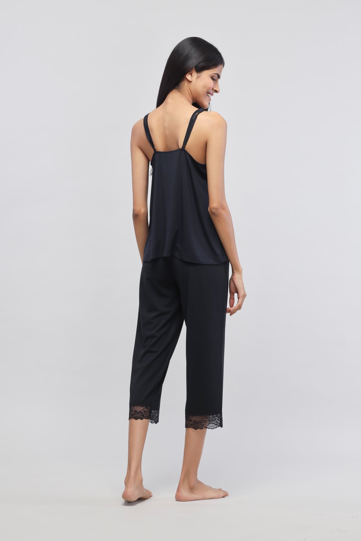 Delicate black lace tank top with elegant back design.