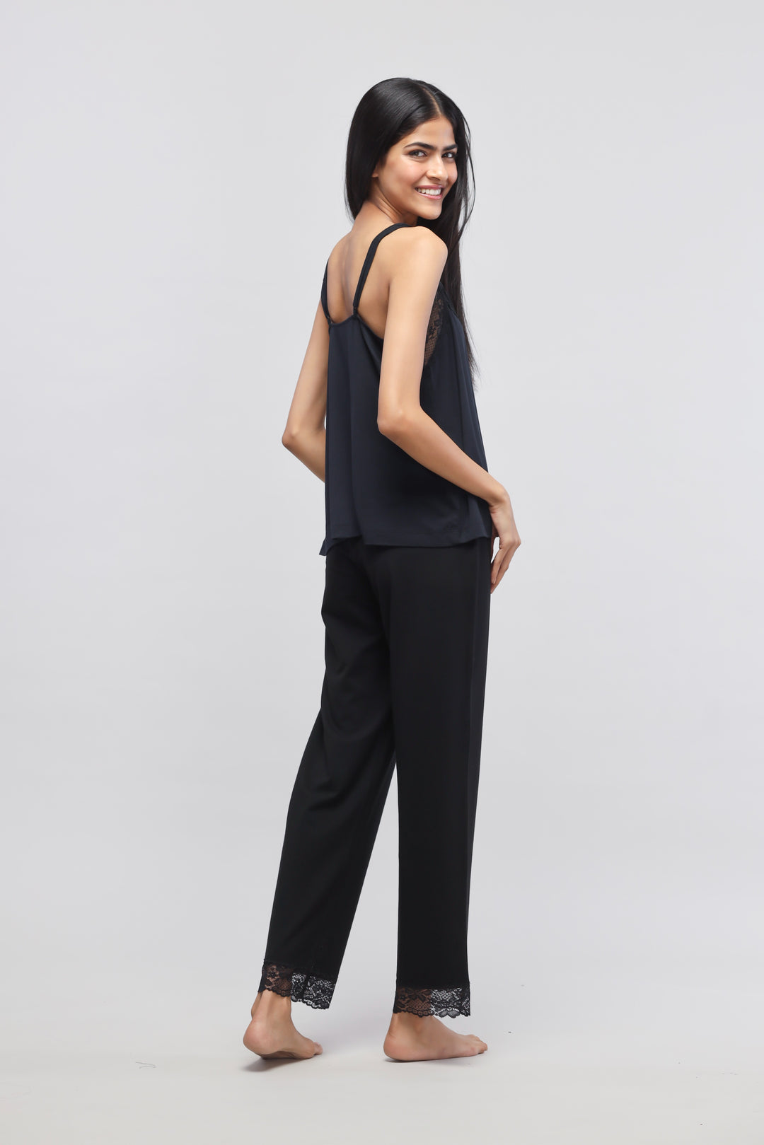 Delicate black lace pajama set with tank top for women.