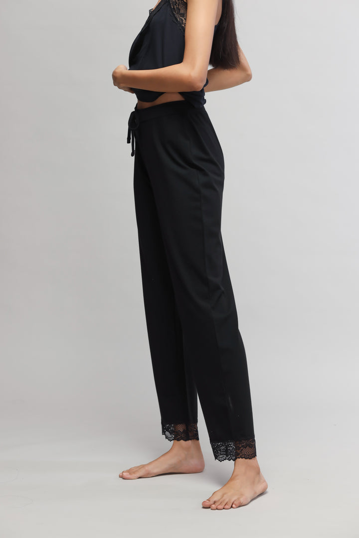 Delicate black lace pajama set featuring stylish lace trim.