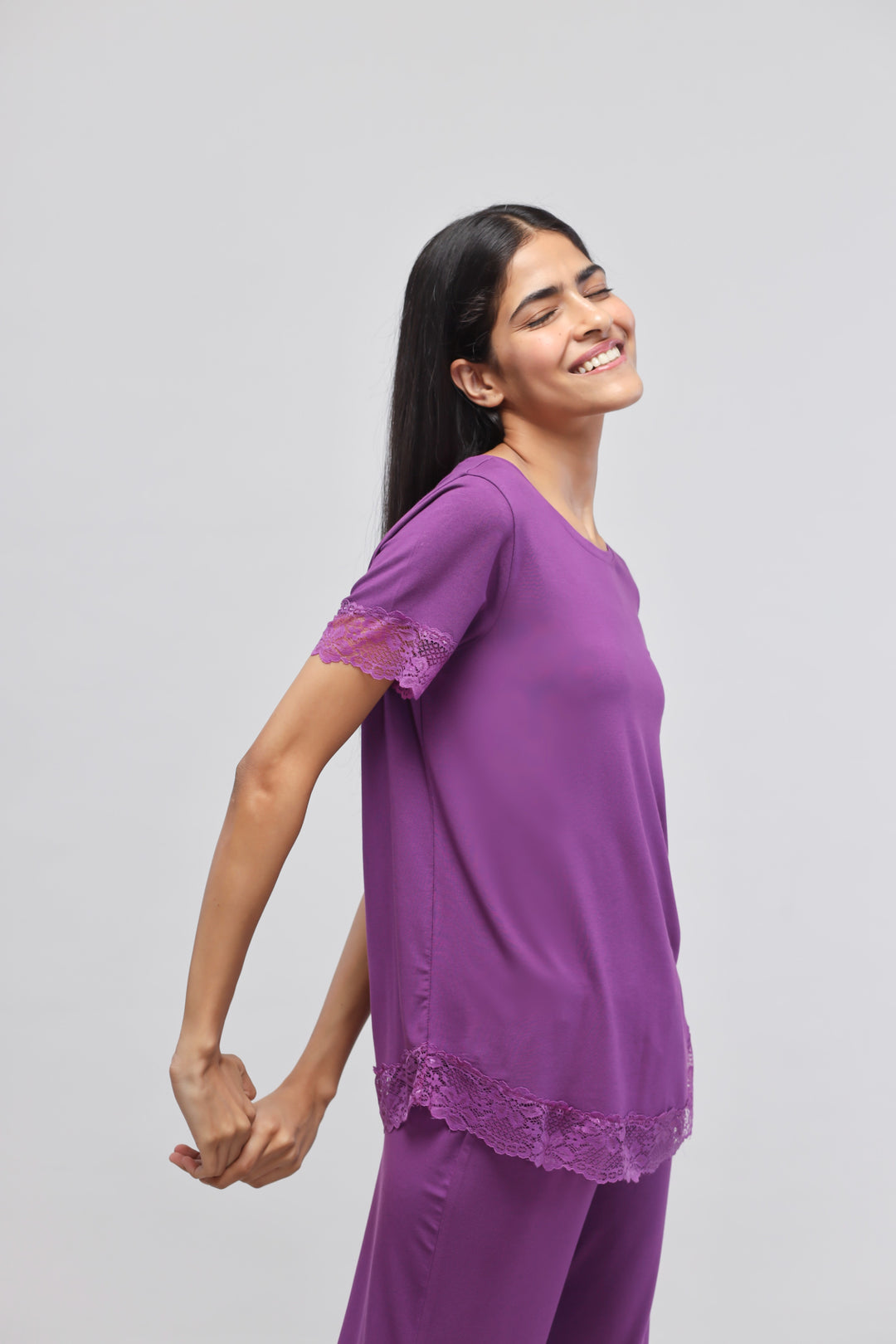 Dreamy purple lace pajama set with stylish design and comfort.
