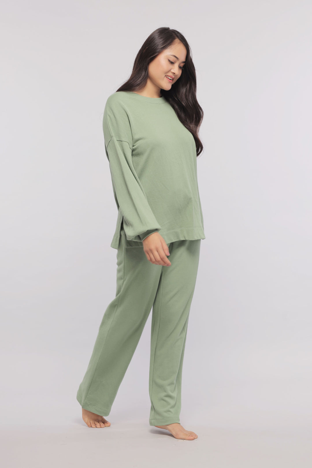 Mint green terry long sweatshirt worn with matching pants.