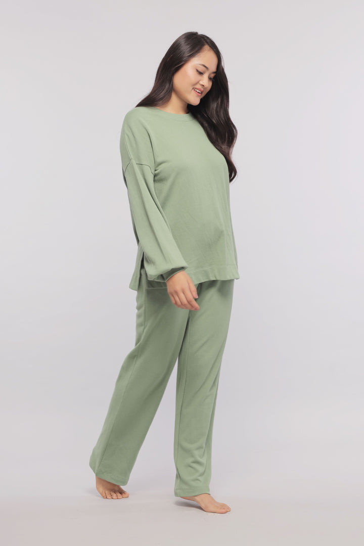 Mint green terry long sweatshirt worn with matching pants.
