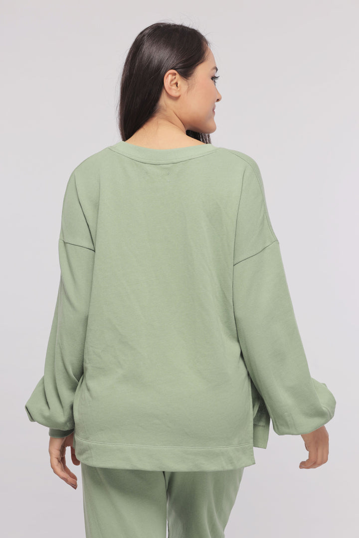 Mint green Terry long sweatshirt with relaxed fit and cozy style.