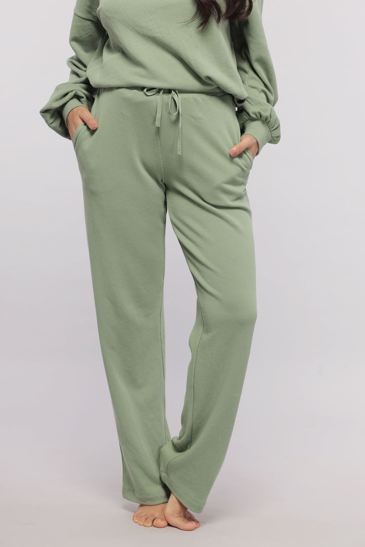 Mint green terry travel loungers with pockets, perfect for comfort.