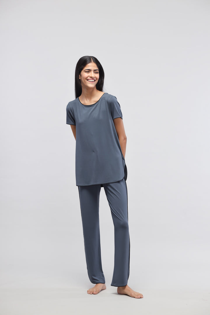 Deep Blue Piping Pajama Set on a smiling model.