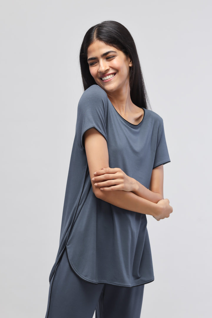 Deep Blue Piping Top worn by smiling woman, stylish and comfortable design.