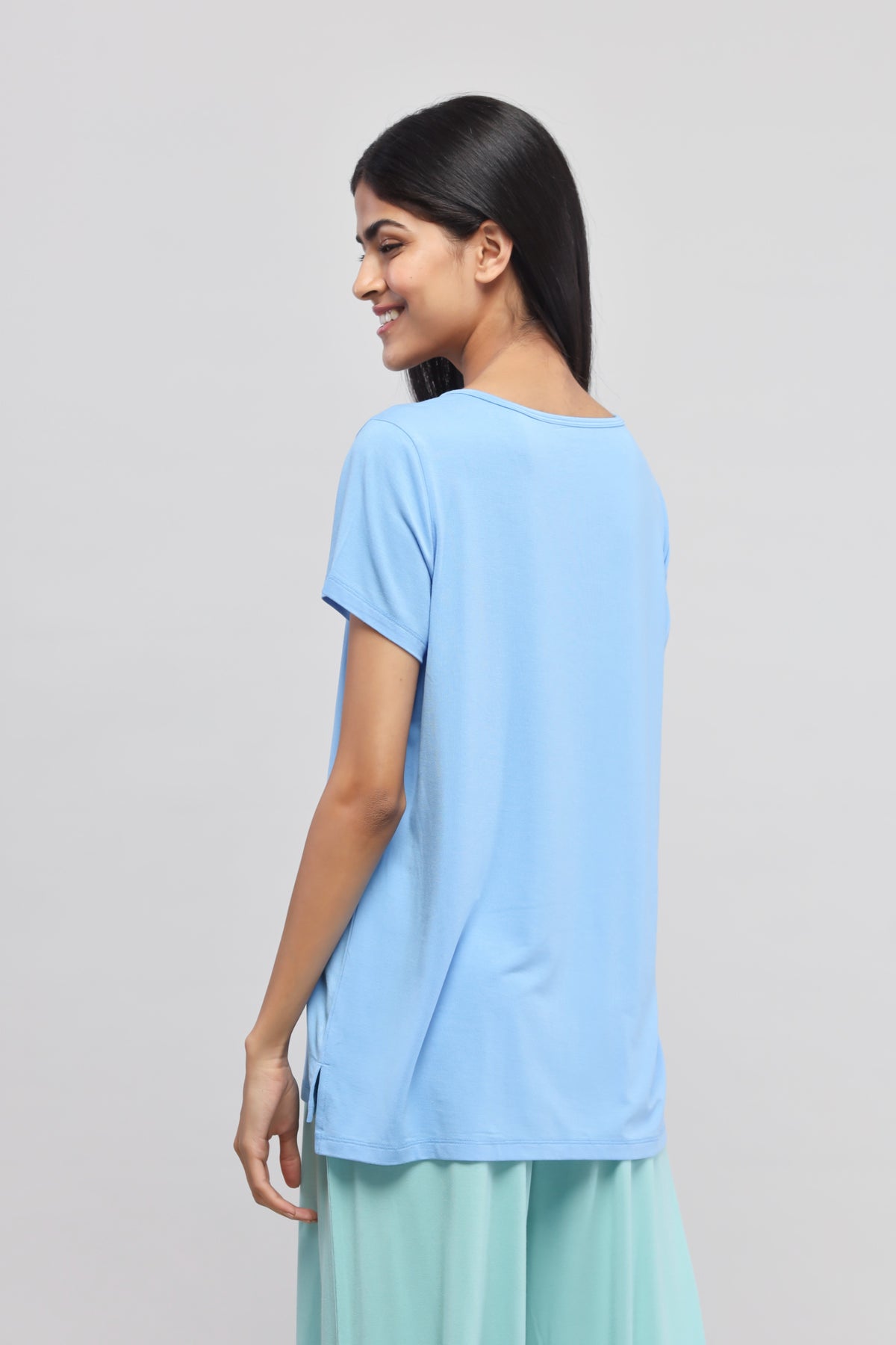 Summer Blue V-Neck Top on a model, showcasing relaxed style and fit.