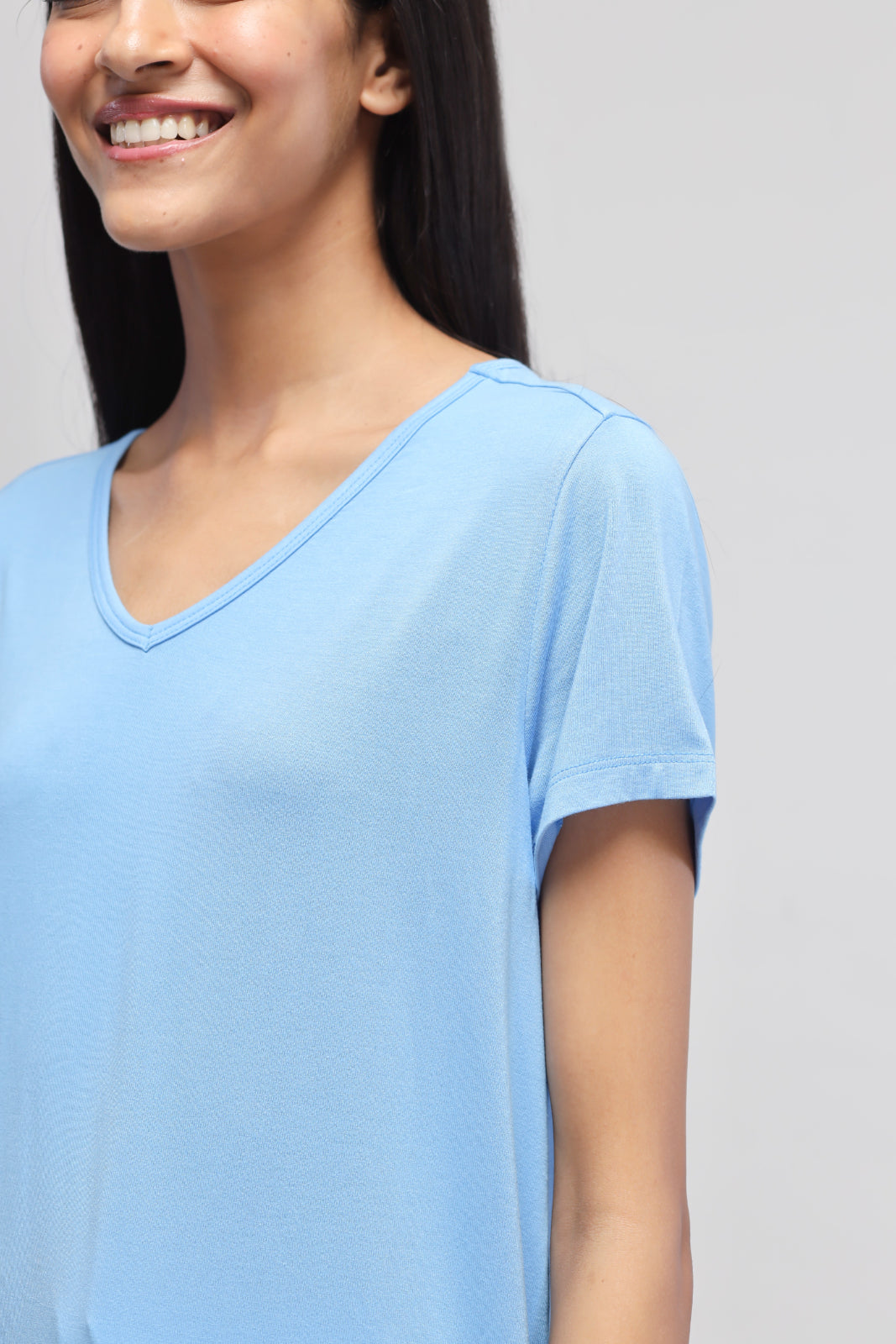 Smiling woman wearing Aqua Culotte Set in soft blue color.