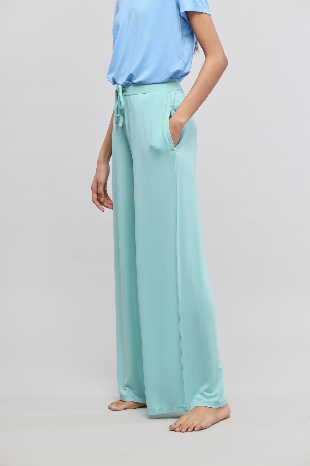 Aqua flared lounge pants with pockets, perfect for casual wear.