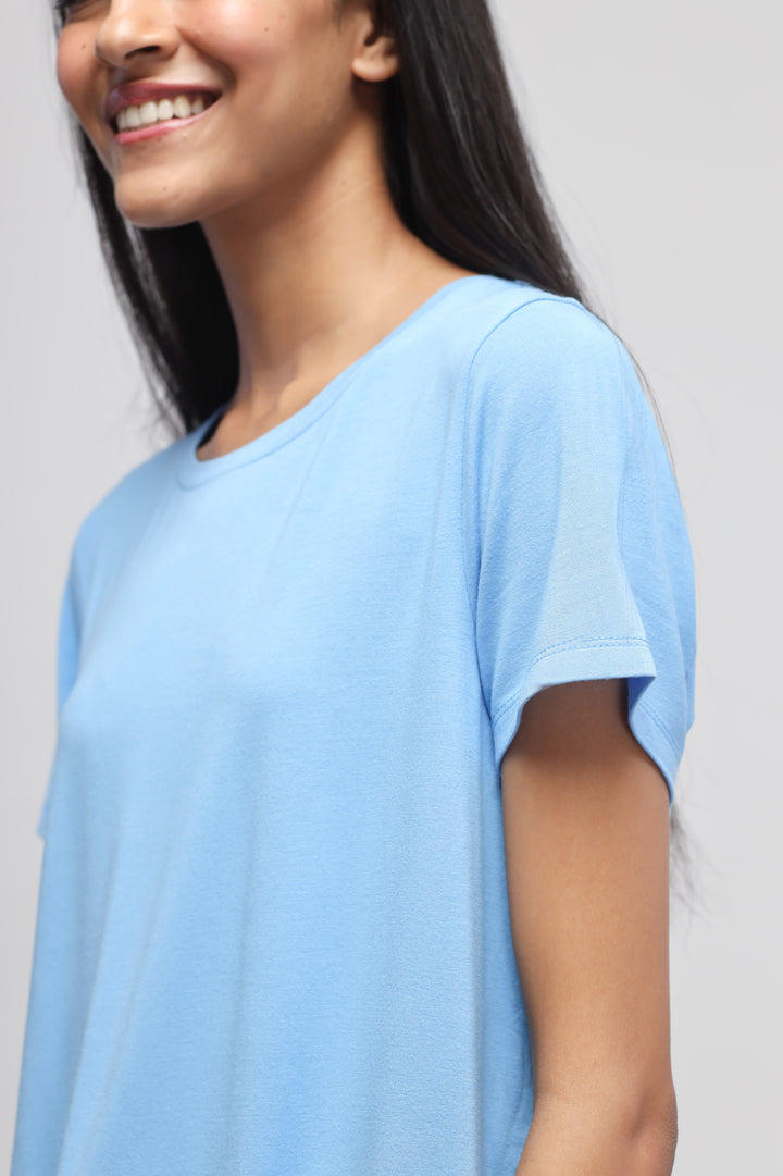Summer Blue Round-Neck Top worn by a smiling model.