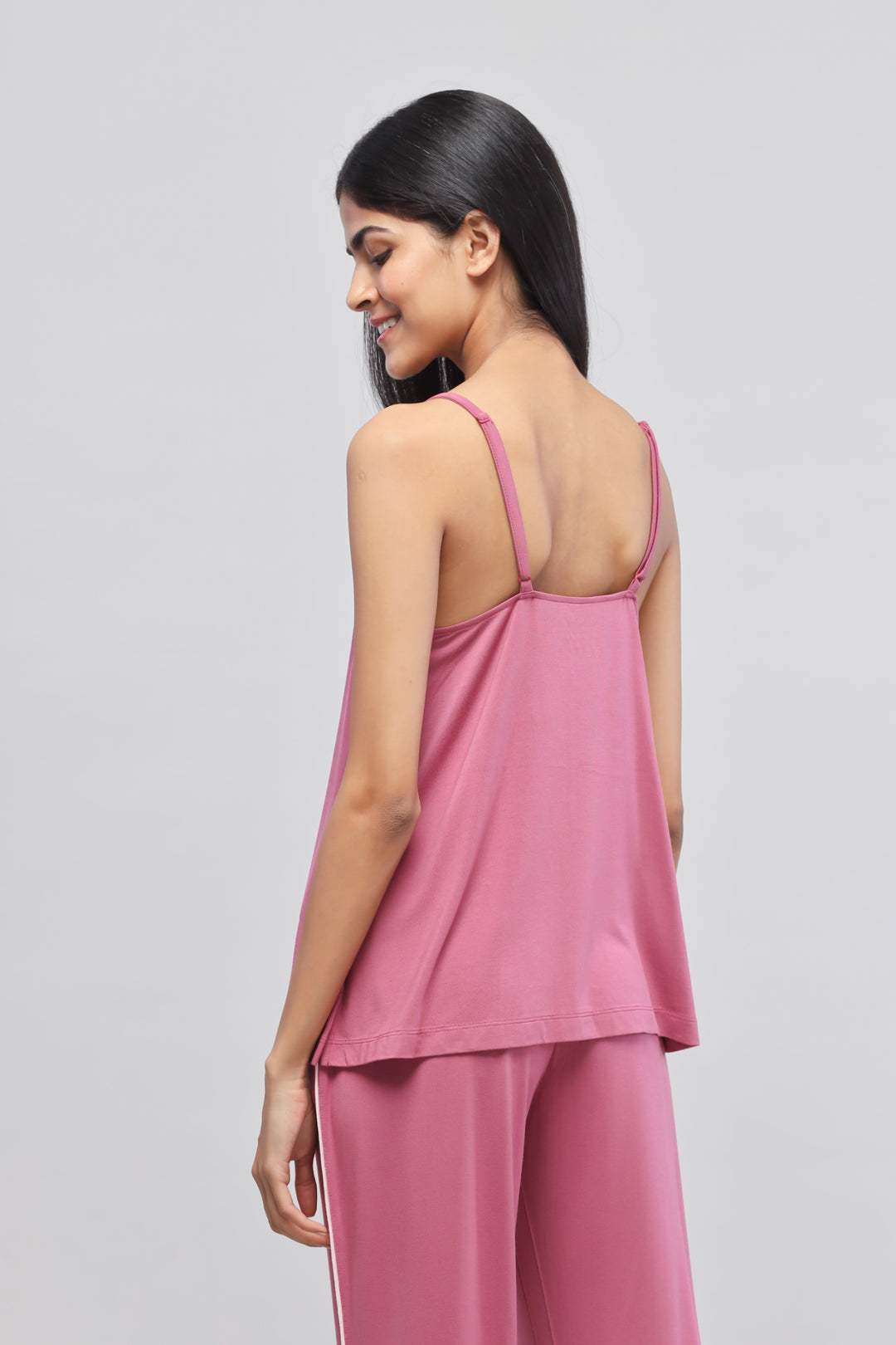 Rosy pink tank top with adjustable straps, perfect for casual wear.