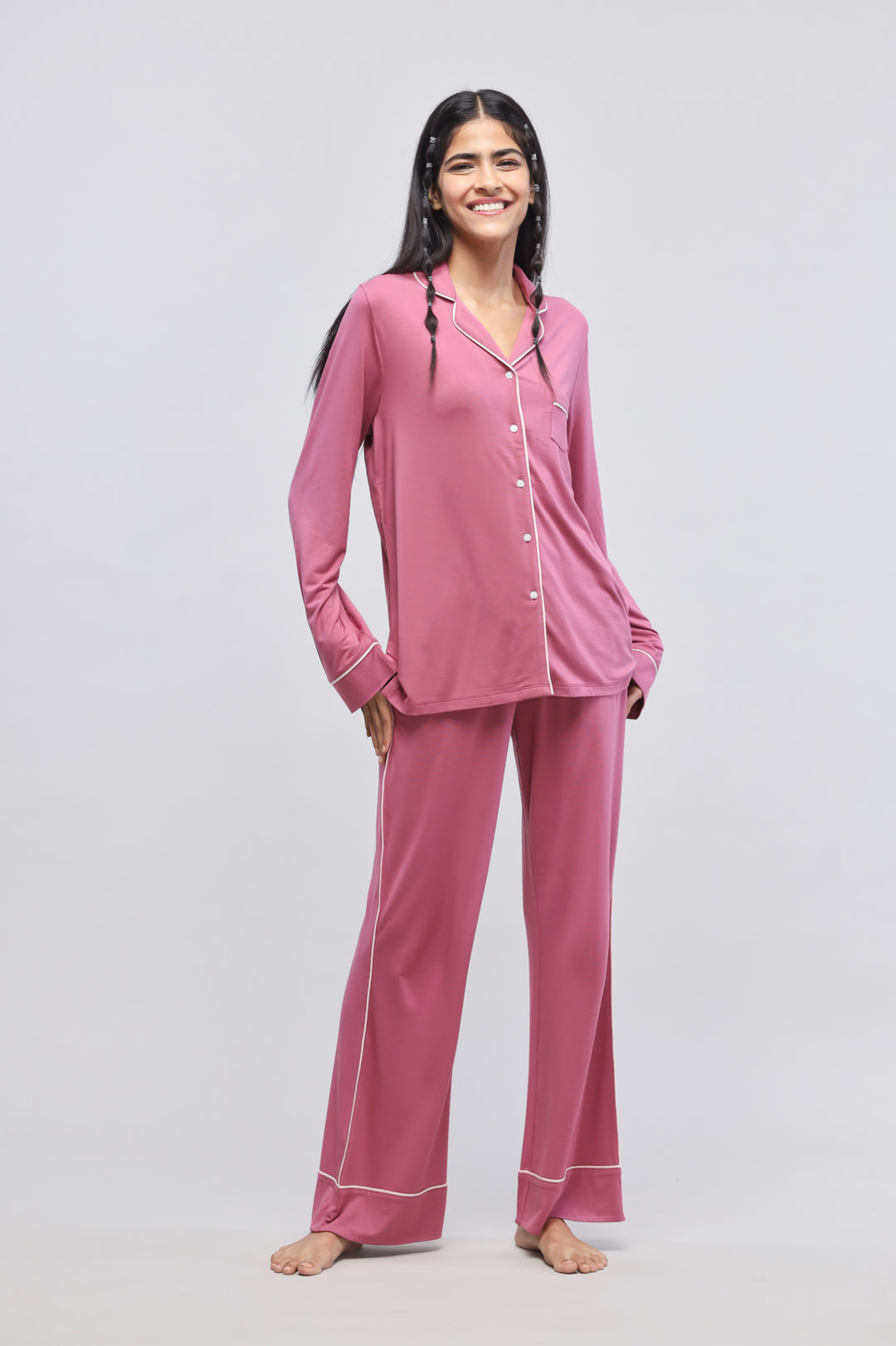 Rosy pink button-down top with piping and full sleeves.