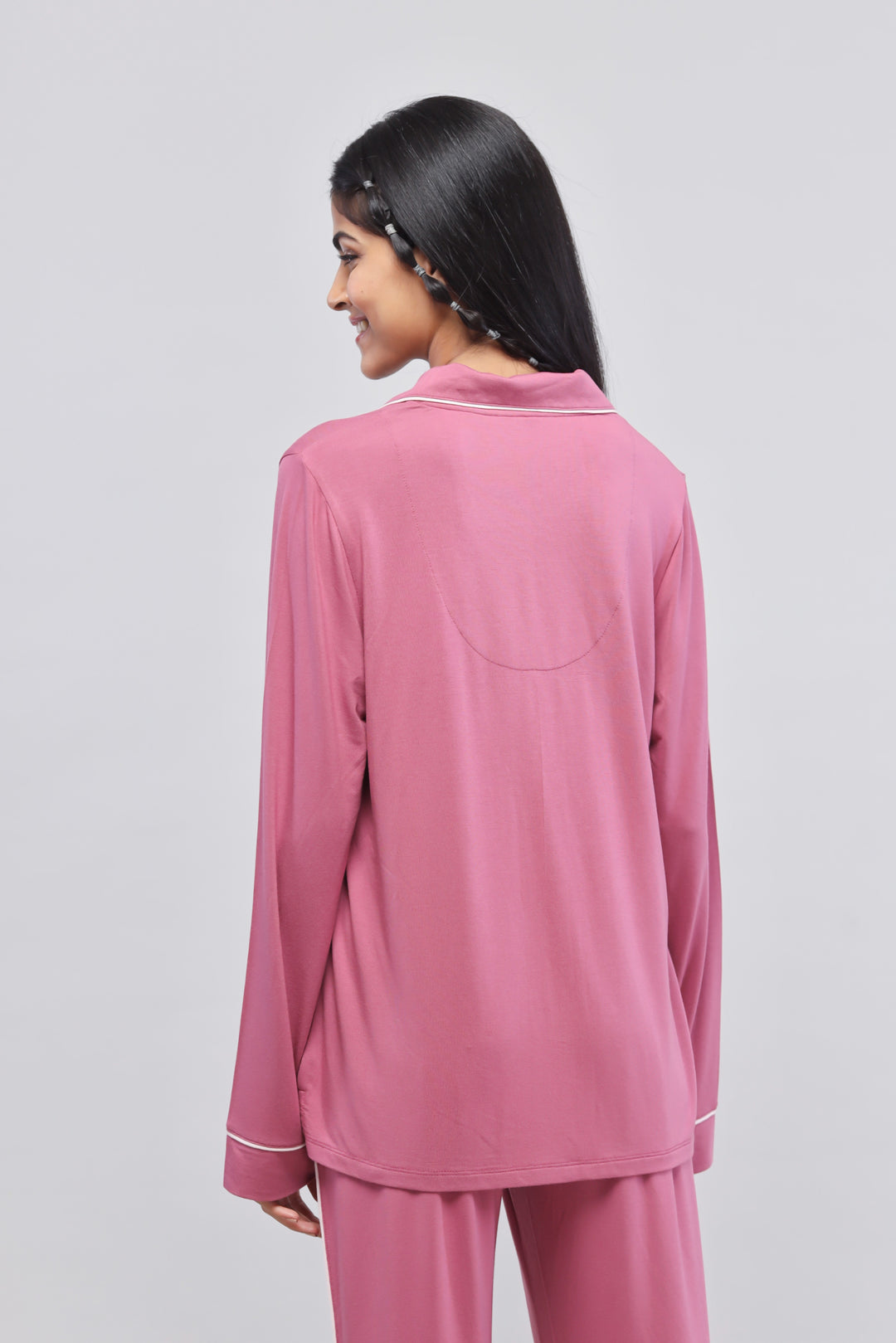 Rosy pink button-down top with full sleeves and piping details.